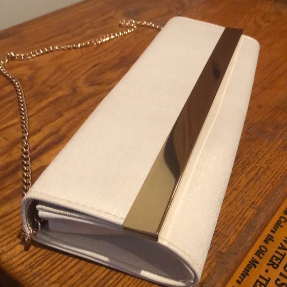 Charming Charlie Handbags - Clutch with gold chain.